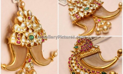 Puligoru pendant designs decored with kundan polki diamonds and rubies