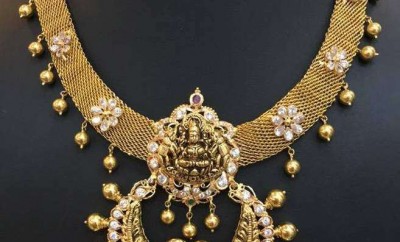 gold jewellery designs necklace with lakshmi devi