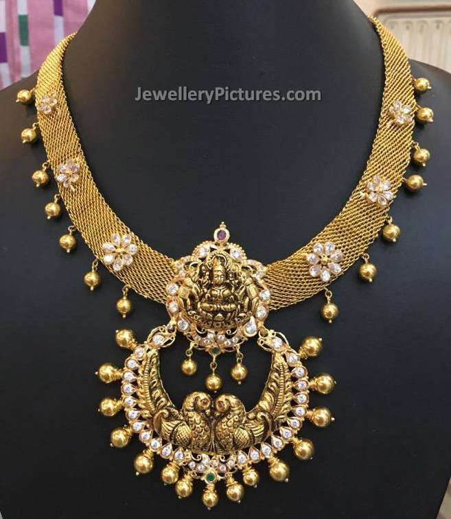 gold jewellery designs necklace with lakshmi devi