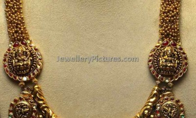 gold lakshmi haram designs with nine lakshmi devi motifs