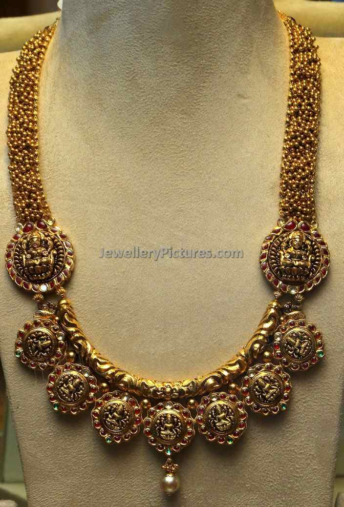 gold lakshmi haram designs with nine lakshmi devi motifs