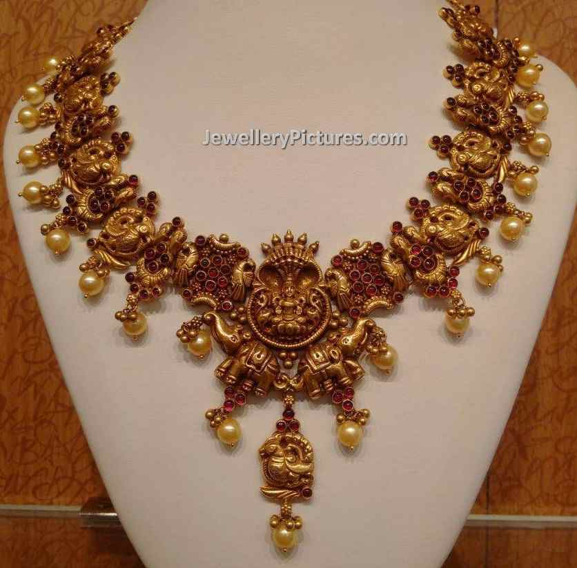 temple jewellery designs catalogue gold with nakshi work
