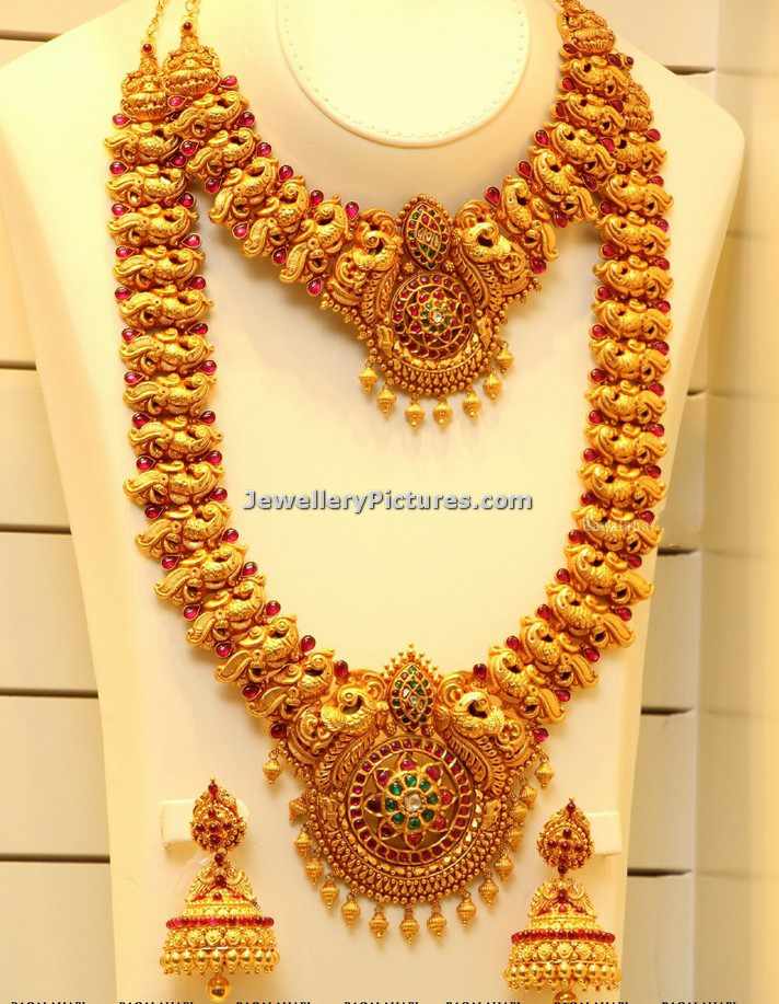 antique peacock haram and necklace design from joyalukkas